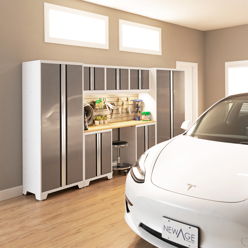 Sleek White and Platinum Cabinet System in a Sunlit Garage with a White Car