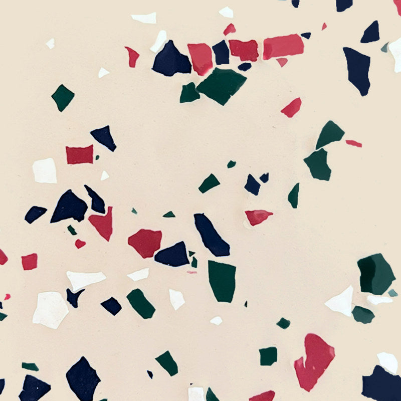 ArmorPoxy Desert Tan medium broadcast flake swatch: ivory polyaspartic base with navy, green, burgundy and white flecks