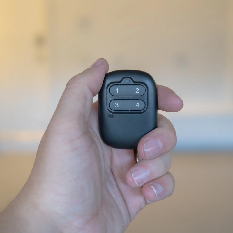 Auxx Lifts Remote holding front