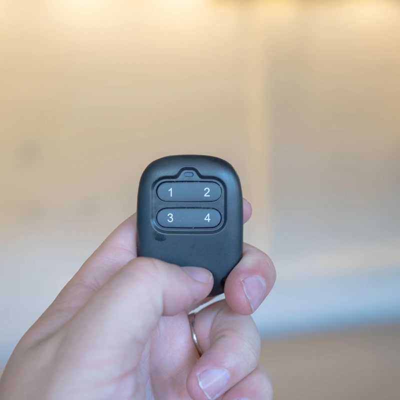 Auxx Lift Remote Control holding
