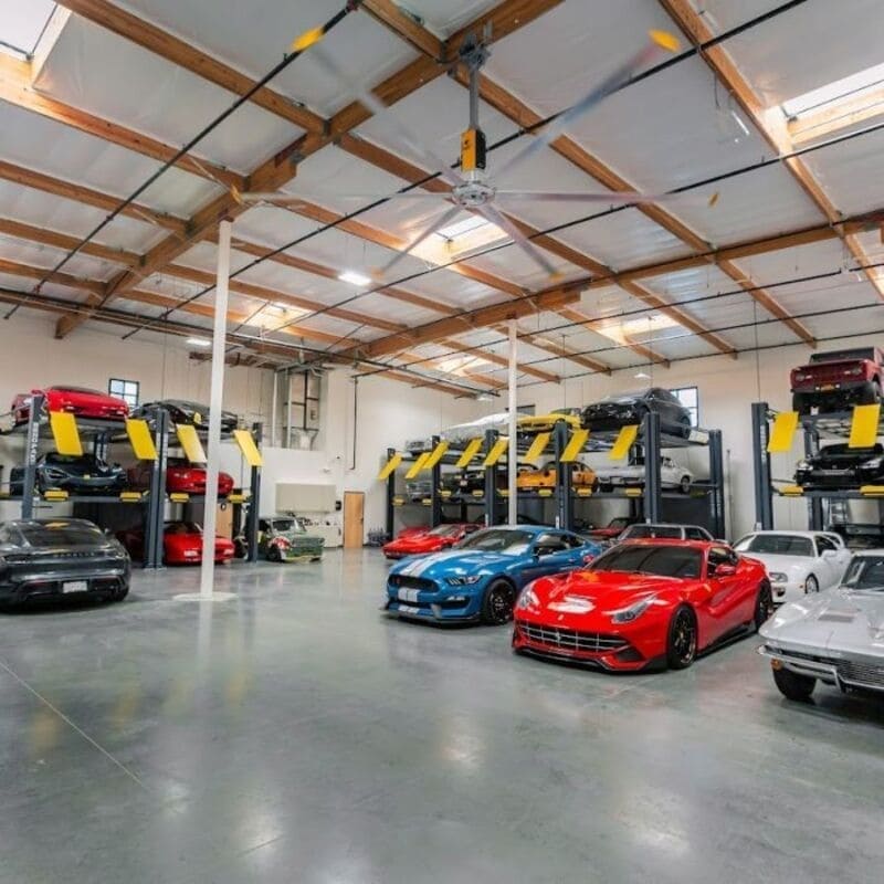 BendPak HD973P storing multiple exotic cars inside triple stacker