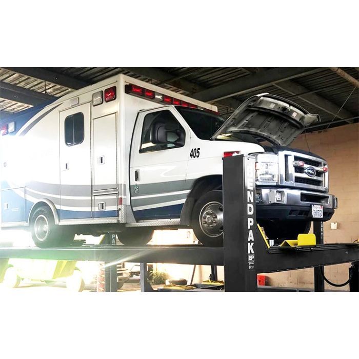 BendPak 4 Post 14000lb HDS-14 Car Storage Lift With Chevy Lifestyle With Ambulance Lifted