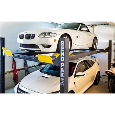 BendPak HD-9XW 4 Post Car Lift 9000lb Lifestyle 2 White Cars Stacked In Home Garage