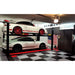 BendPak HD-9XL 4 Post Car Lift 9000lb 2 cars in black and red garage