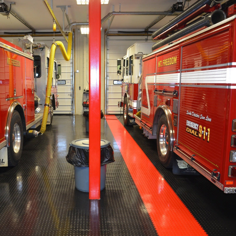 PVC Garage Tiles Showing Commercial Use For SupraTile Interlocking Coin Tiles - Black And Red With Fire Trucks