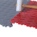 SupraTile Diamond Plate Pattern PVC Garage Tiles In Red And Gray With An Example OF How A Rubber Mallet Is Used To Install The Tiles