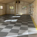 Diamond Pattern Garage Floor Tile Installed In A New Build Garage With Dark And Light Gray Checkered Pattern and Yellow Edging