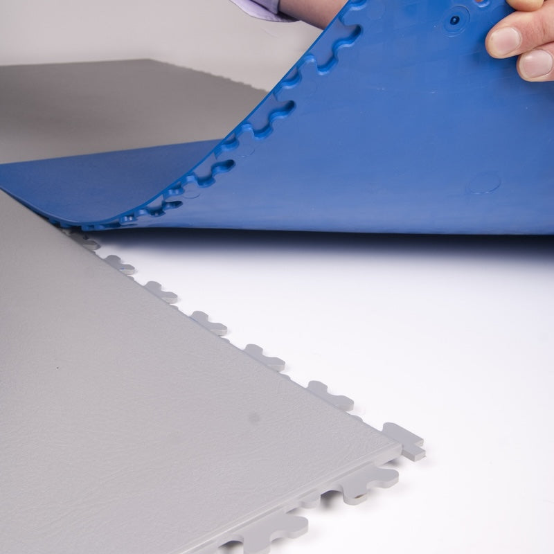 Close Up Of Hidden Dovetail Interlocking Pattern On Blue And Light Gray PVC Garage Floorin Tiles