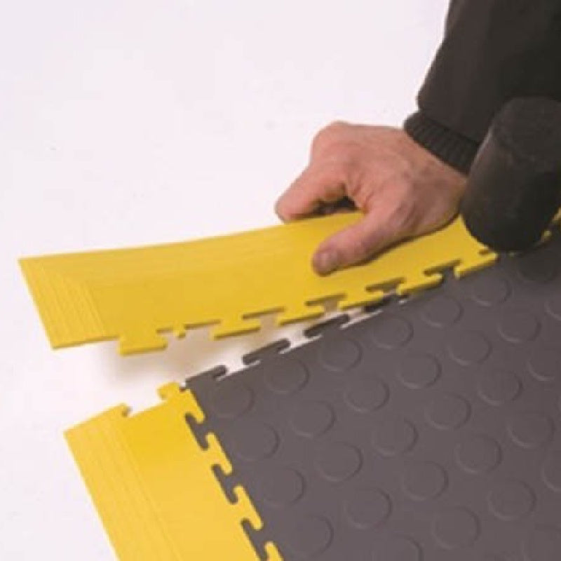 PVC Garage Flooring Tiles Getting The Finishing Touch With Yellow Corner Piece