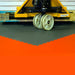 Commercial Use PVC Flooring Tiles Shown Holding Up Against A Heavy Pallet Jack