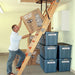 Man Shown Lifting Heavy Items Up Attic Ladder Without The Versa Attic Lift