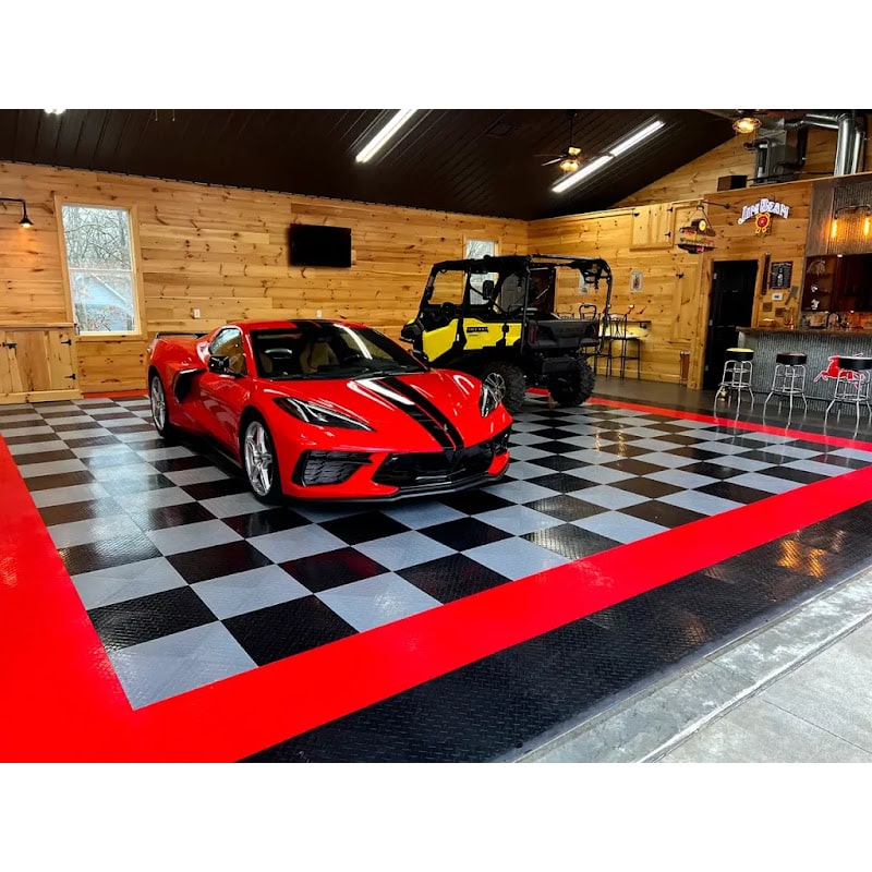 Chevy Corvette on a Red, Black, and Alloy RaceDeck Diamond Tile Floor in a Modern Luxury Garage