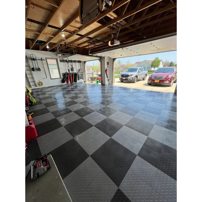 Open Garage Featuring Black and Gray Checkered RaceDeck XL Tiles with Organized Tools and Sunlight Streaming In
