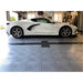 Modern garage design with white Corvette on alloy and graphite RaceDeck CircleTrac Floor Tiles