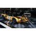 Garage scene with RaceDeck Free-Flow XLC tiles, showcasing a classic gold Ford GT40 on a stylish black and white checkered floor