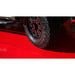 Close-up of a tire on RaceDeck Max Garage Floor Tiles, showcasing a vibrant red surface designed for durability and style