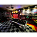 Entertainment space featuring RaceDeck TuffShield Diamond Flooring Tiles, showcasing a pool table and vintage decor with a checkered floor