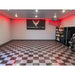 Minimalist garage interior featuring TuffShield Racedeck Garage Flooring, with a Corvette logo and a clean checkered pattern in shades of gray